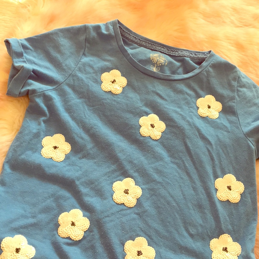 Light blue shirt with white sequin flowers